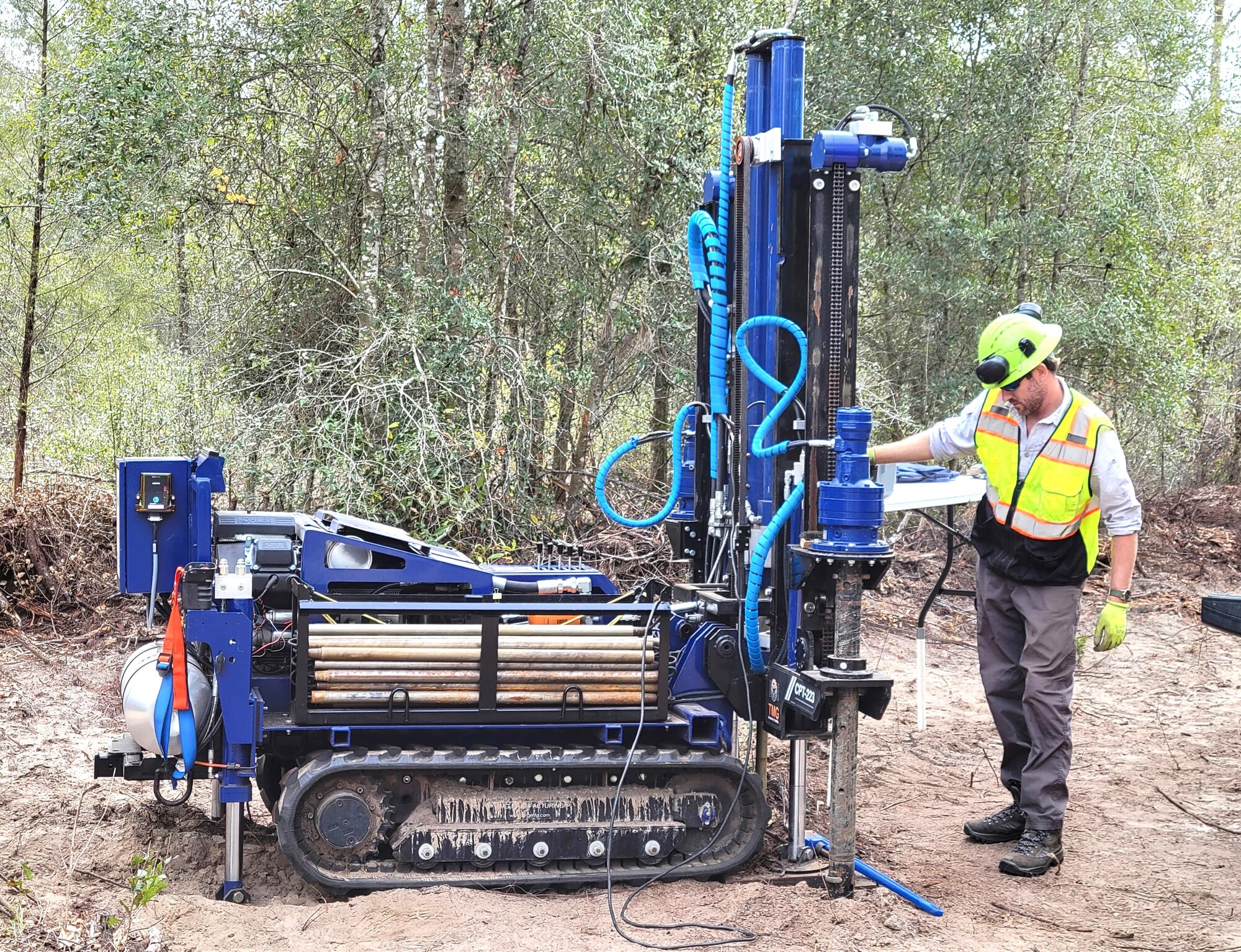 Track-mounted CPT rig and operator in Ambient field photography