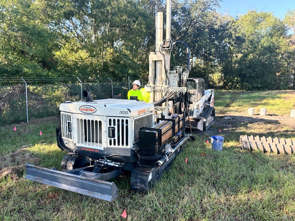 Track-mounted drilling equipment staged for field work in Florida